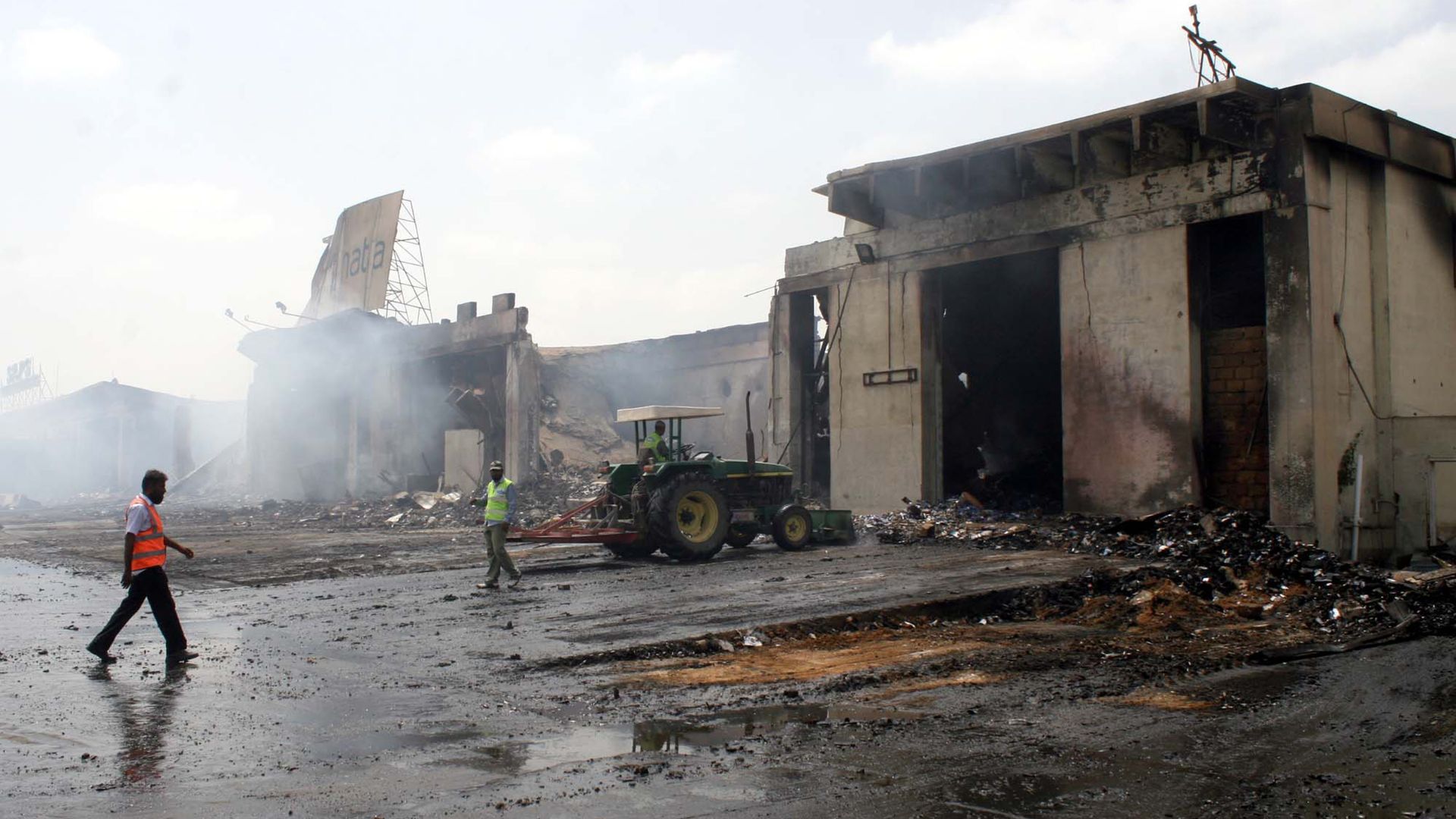 KARACHI, PAKISTAN - JUN10: View of devastated cargo terminal burnt in suicidal blast during attack by Taliban terrorists at Karachi Airport, on June 10, 2014 in Karachi.